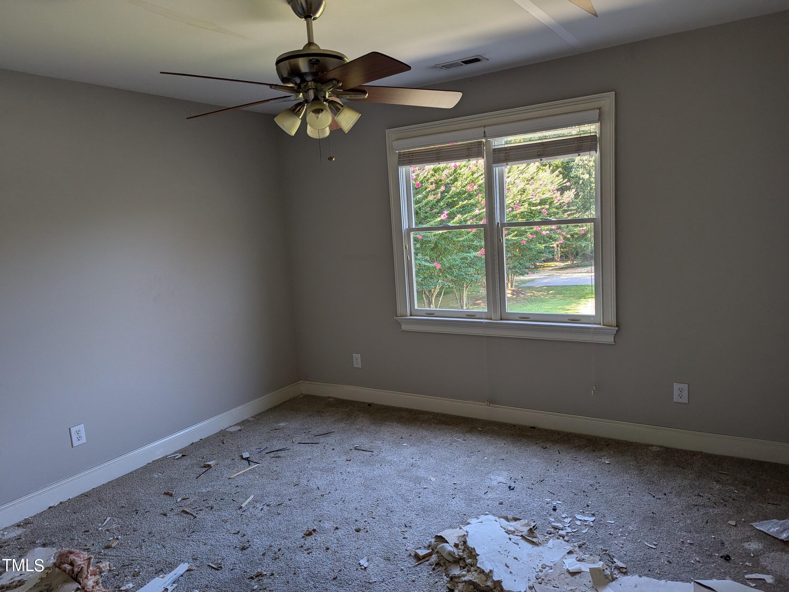 151 Michael Way Clayton, NC 27520 - Photo 28 of 36 a view of room with window and ceiling fan