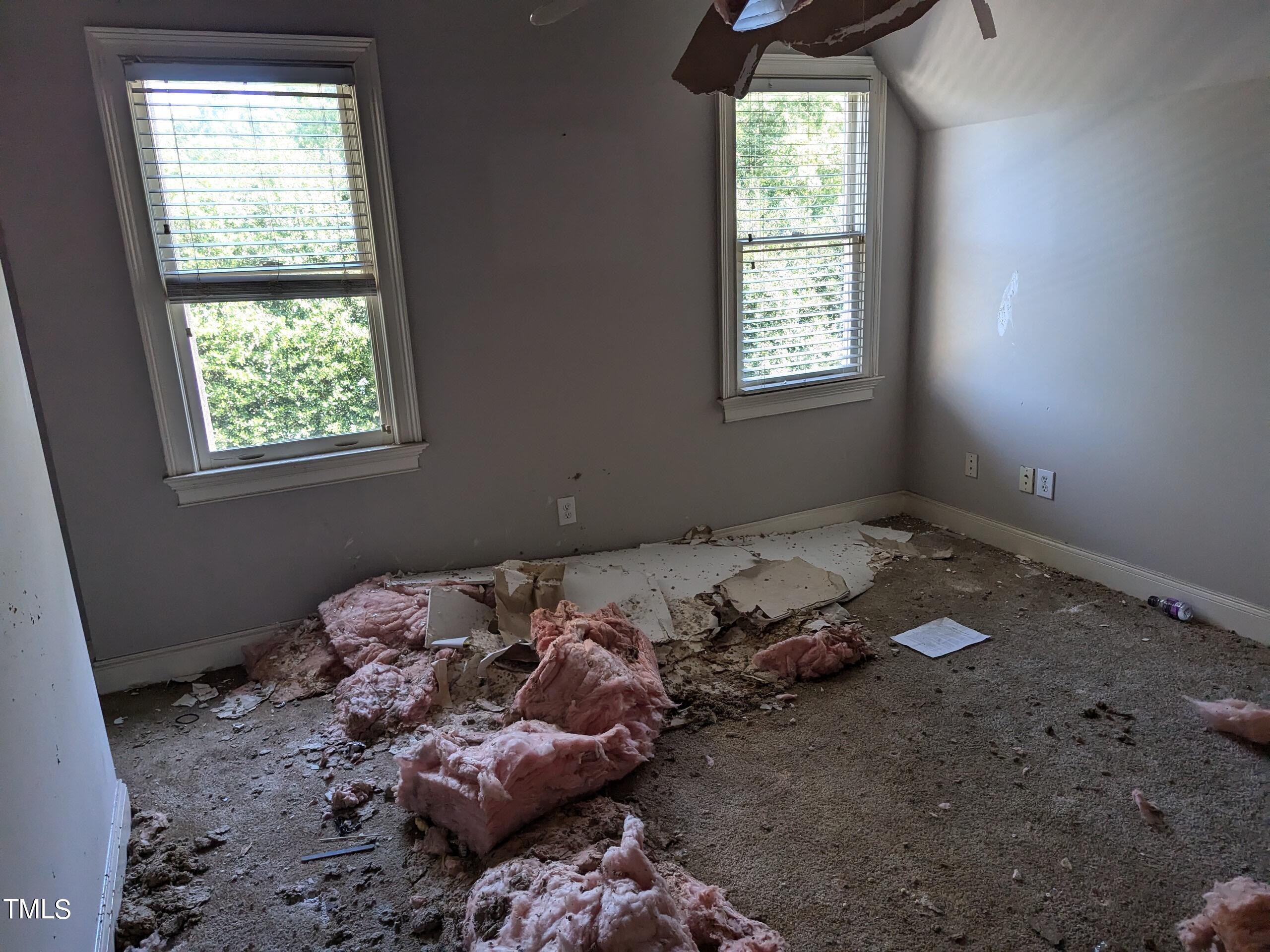 151 Michael Way Clayton, NC 27520 - Photo 29 of 36 a bed sitting in a bedroom next to a window