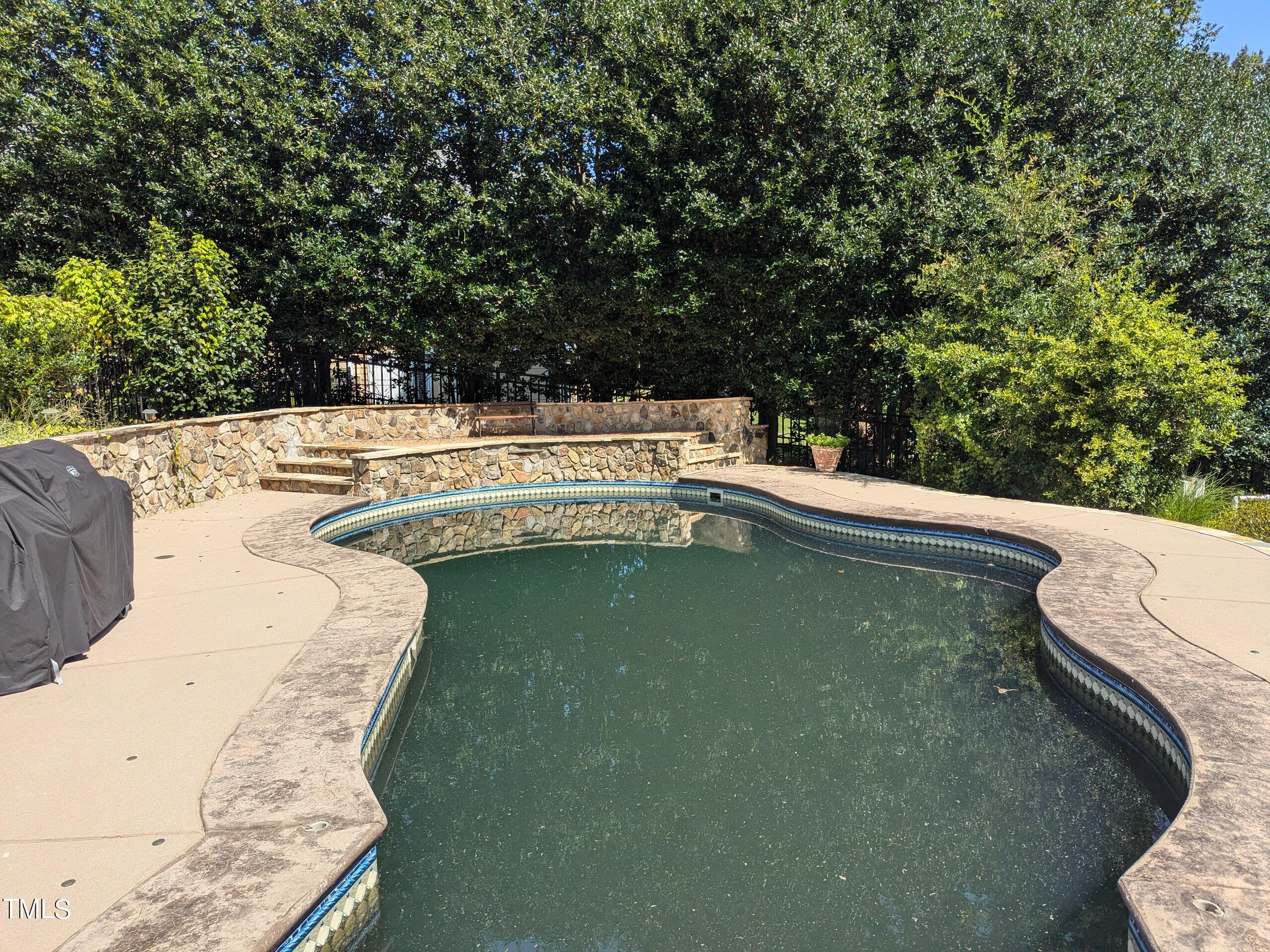 151 Michael Way Clayton, NC 27520 - Photo 33 of 36 a view of a swimming pool with a yard