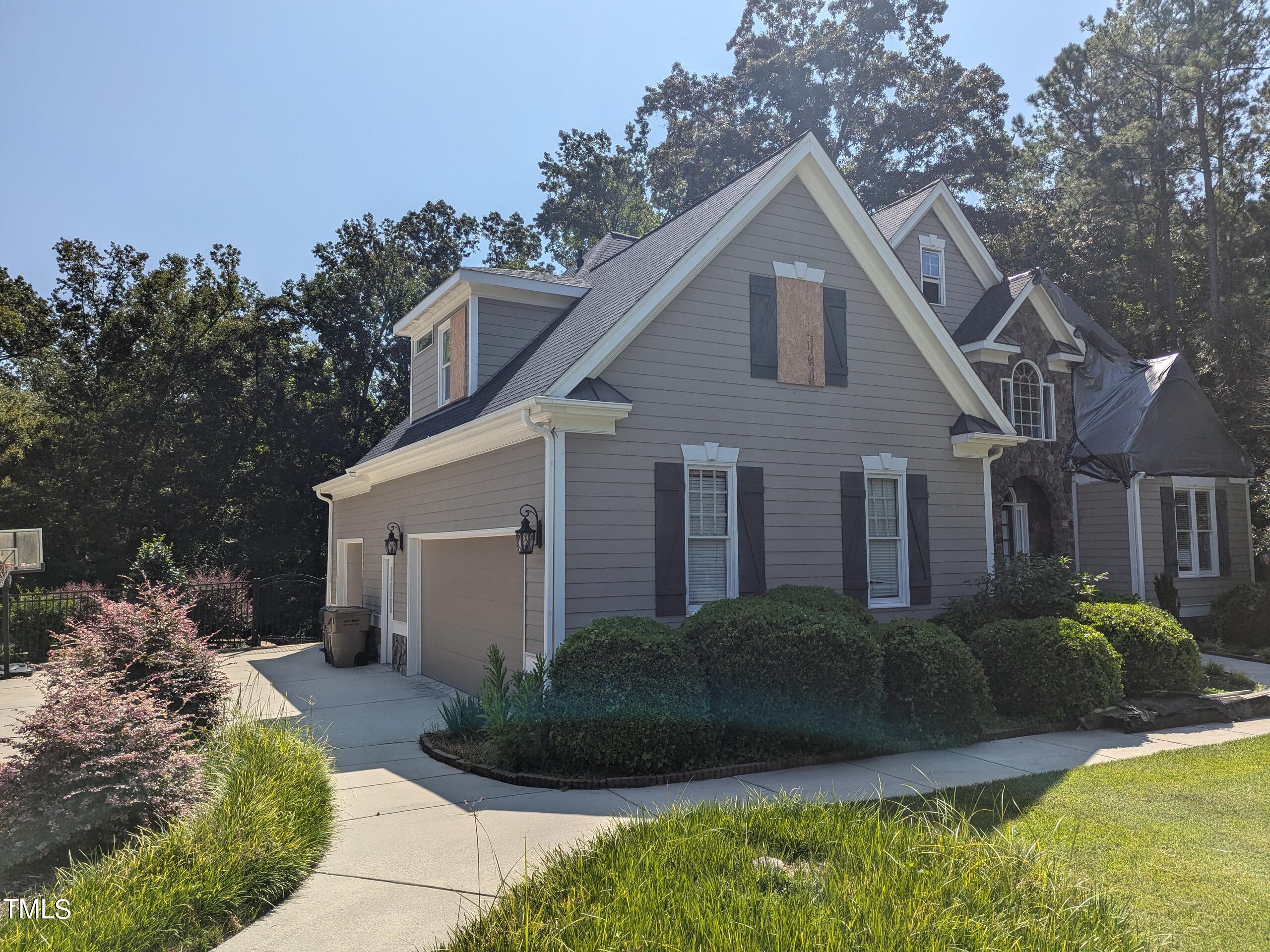 151 Michael Way Clayton, NC 27520 - Photo 4 of 36 a front view of a house with a garden