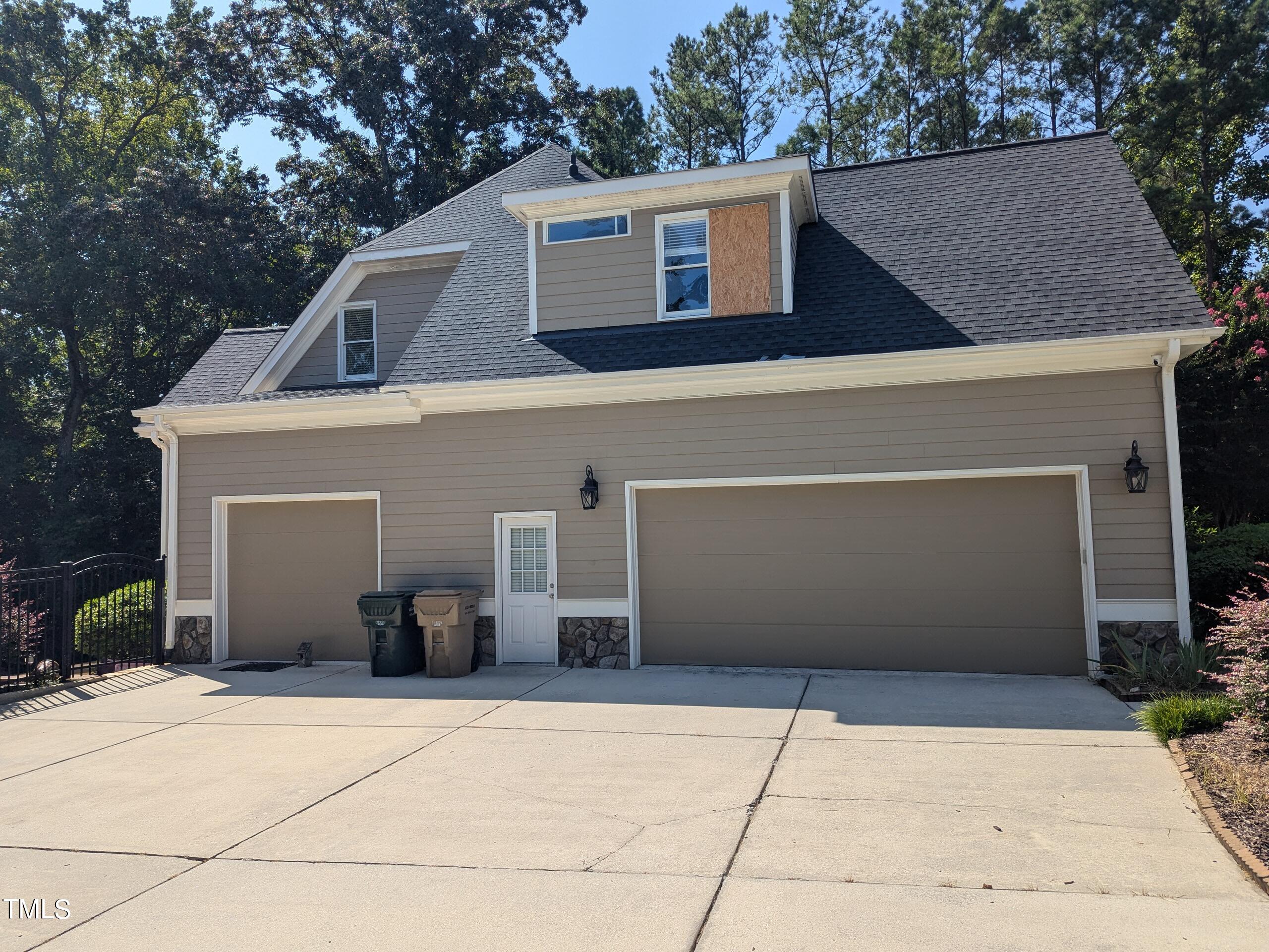 151 Michael Way Clayton, NC 27520 - Photo 5 of 36 a front view of a house with garage