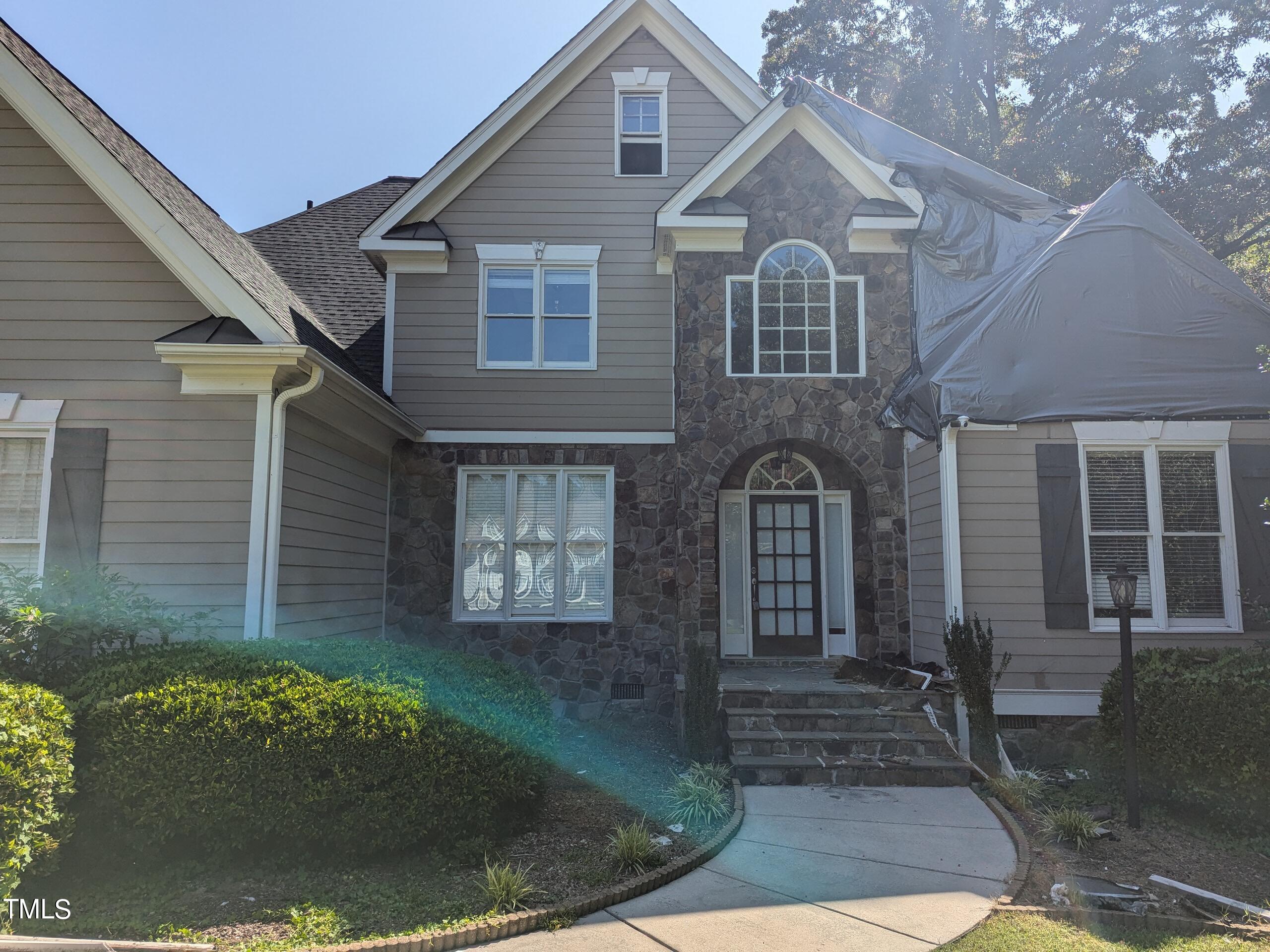 151 Michael Way Clayton, NC 27520 - Photo 7 of 36 a front view of a house with garden