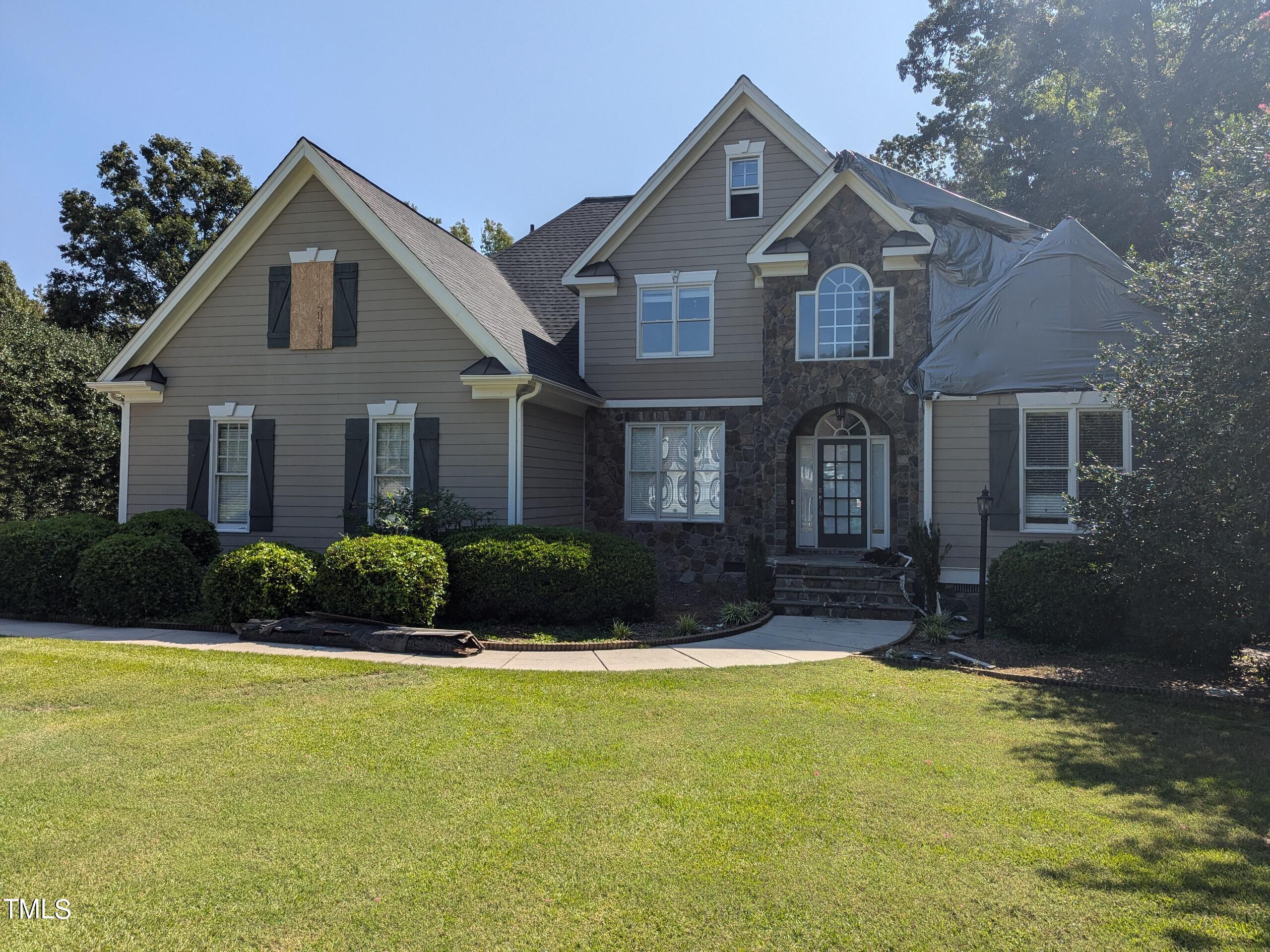 151 Michael Way Clayton, NC 27520 - Photo 8 of 36 a front view of a house with a yard and garage