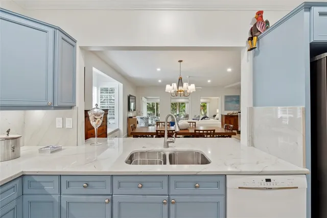 a kitchen with a sink cabinets and window