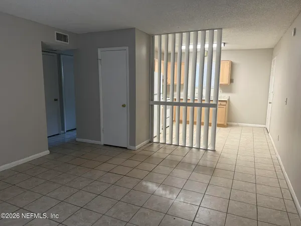 a view of empty room with windows