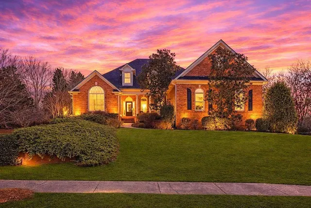 a front view of a house with a yard