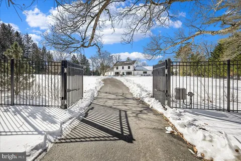 a view of a backyard with wooden fence