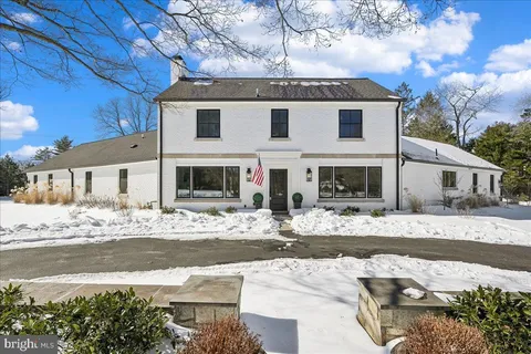 a view of a house with a snow on the road
