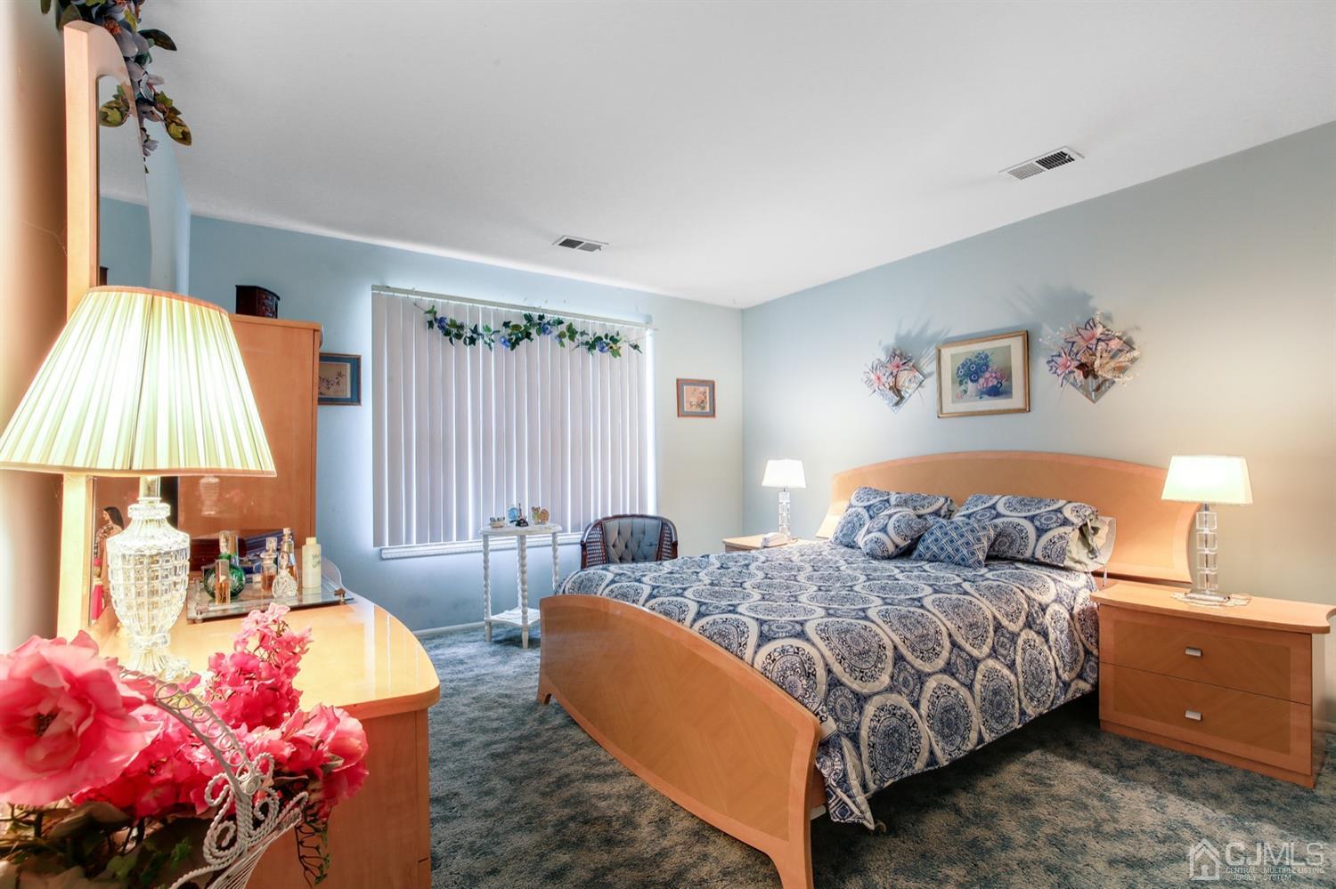 149 Woodbury Road Edison, NJ 08820 - Photo 11 of 19 a bedroom with bed and a window
