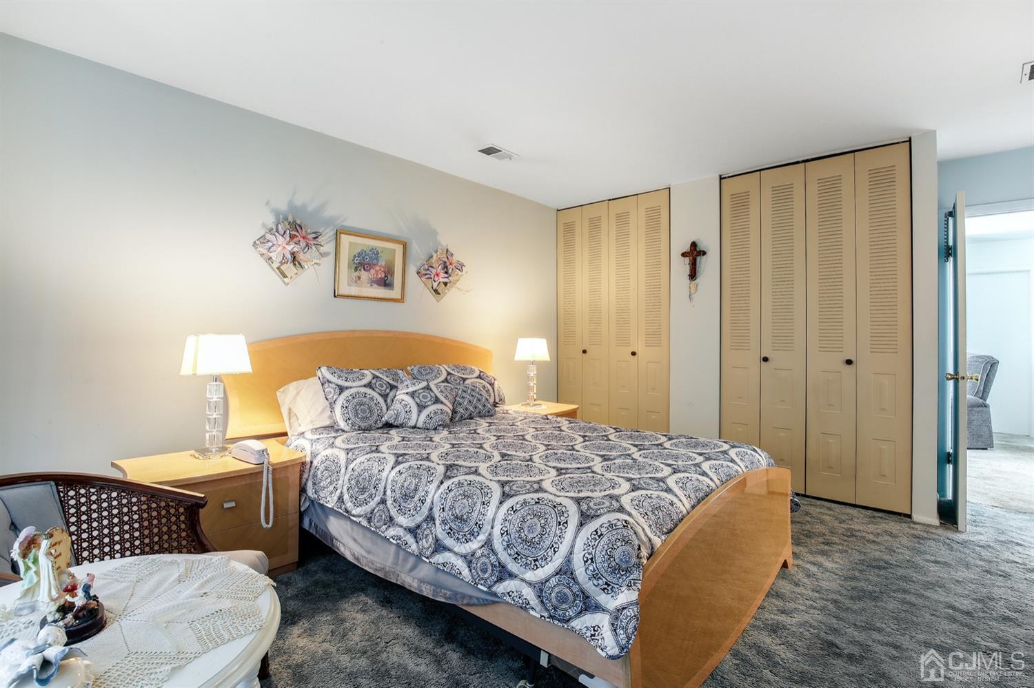 149 Woodbury Road Edison, NJ 08820 - Photo 12 of 19 a bedroom with a bed and a couch