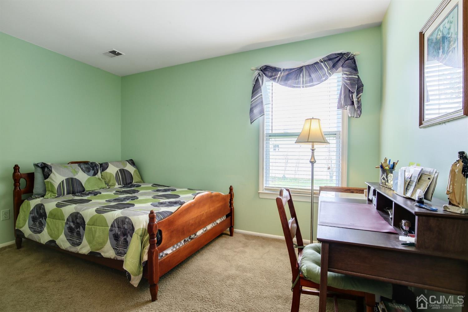 149 Woodbury Road Edison, NJ 08820 - Photo 13 of 19 a bedroom with a bed and a table