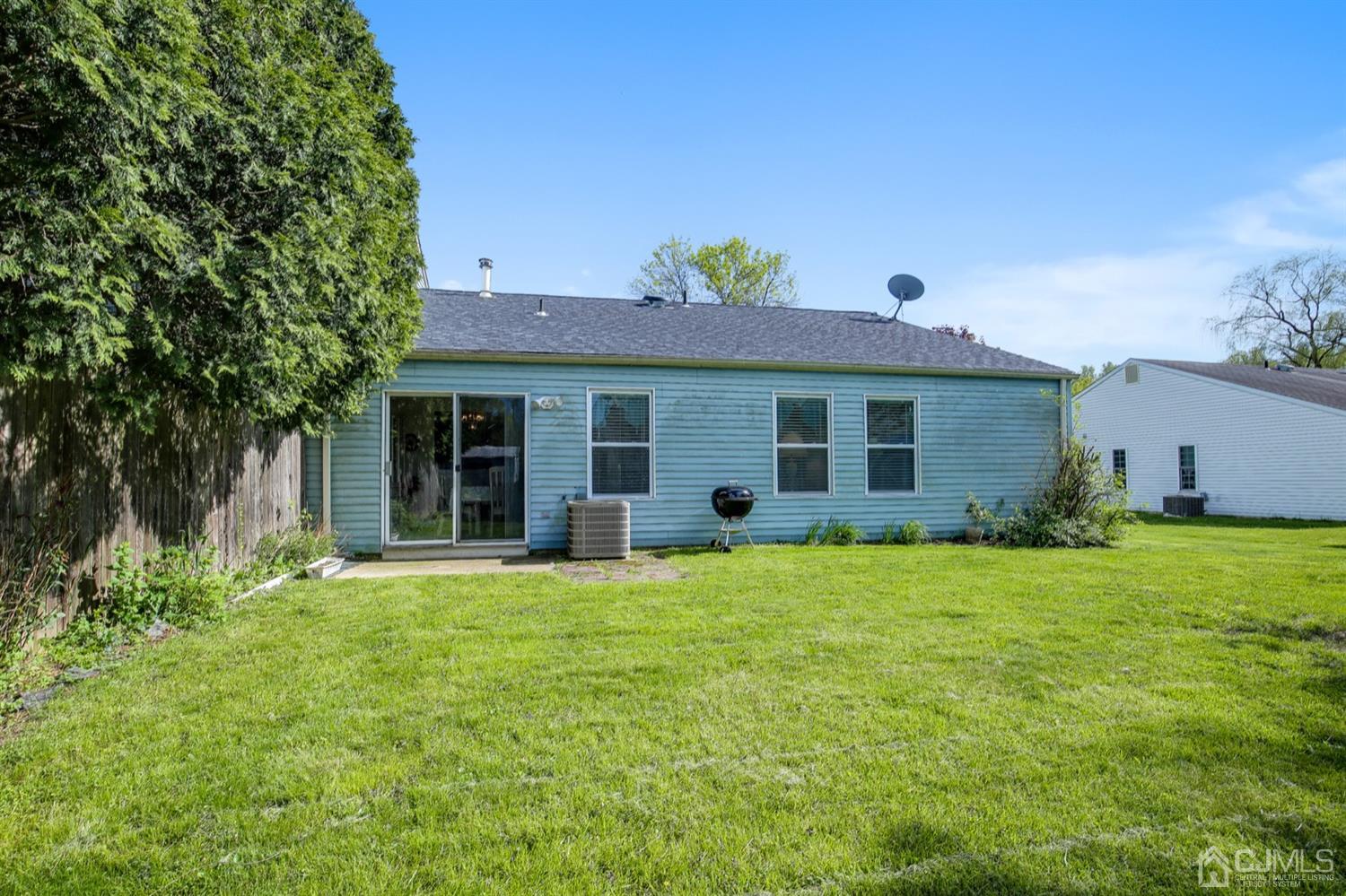 149 Woodbury Road Edison, NJ 08820 - Photo 17 of 19 a front view of a house with a garden