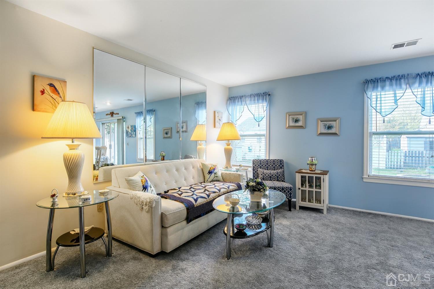 149 Woodbury Road Edison, NJ 08820 - Photo 6 of 19 a living room with furniture and a window