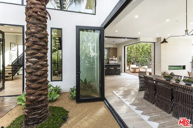 a lobby with furniture and floor to ceiling window