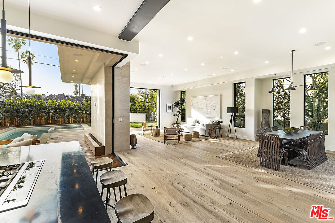 8566 Colgate Avenue Los Angeles, CA 90048 - Photo 5 of 22 a living room with furniture floor to ceiling window and wooden floor