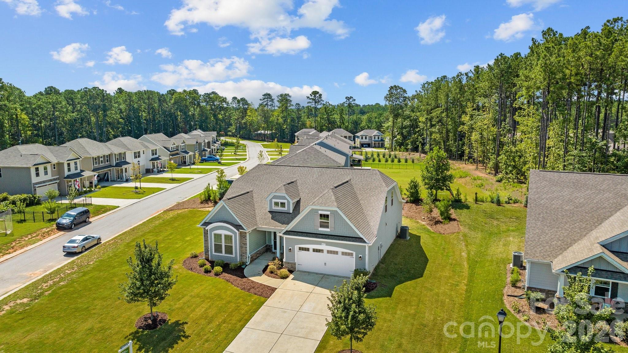 4697 Rinaldo Road York, SC 29745 - Photo 30 of 37 a view of a swimming pool with a garden and trees