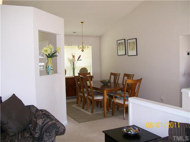 4760 Cardinal Grove Boulevard Raleigh, NC 27616 - Photo 3 of 13 Another view of the living room to the open dining room.
