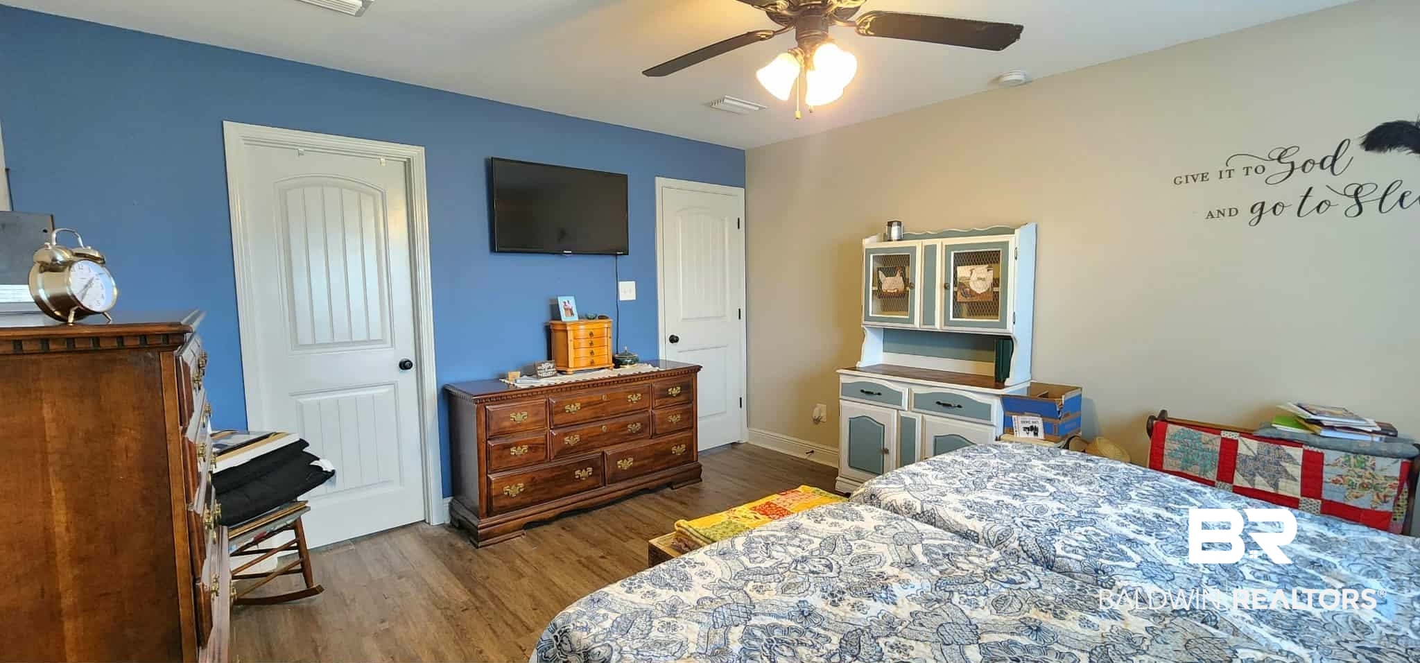 15623 Medway Court Foley, AL 36535 - Photo 18 of 29 Bedroom with dark wood finished floors, a closet, and ceiling fan