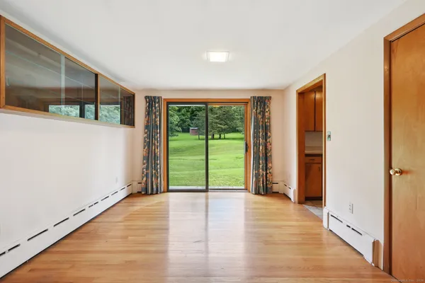 a view of an empty room with a window