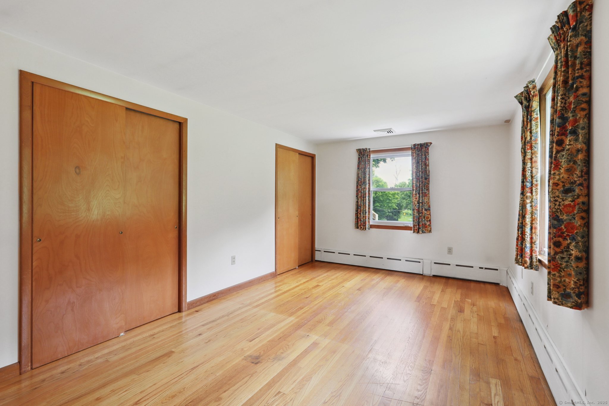 77 Old Middle Road Brookfield, CT 06804 - Photo 17 of 31 an empty room with wooden floor and windows