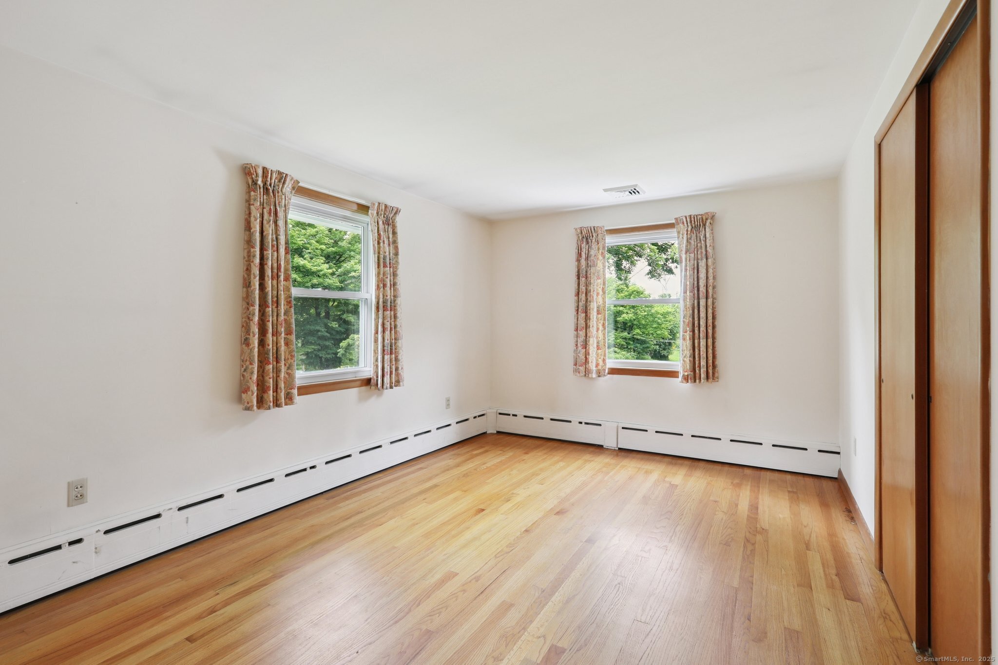 77 Old Middle Road Brookfield, CT 06804 - Photo 19 of 31 an empty room with wooden floor and windows