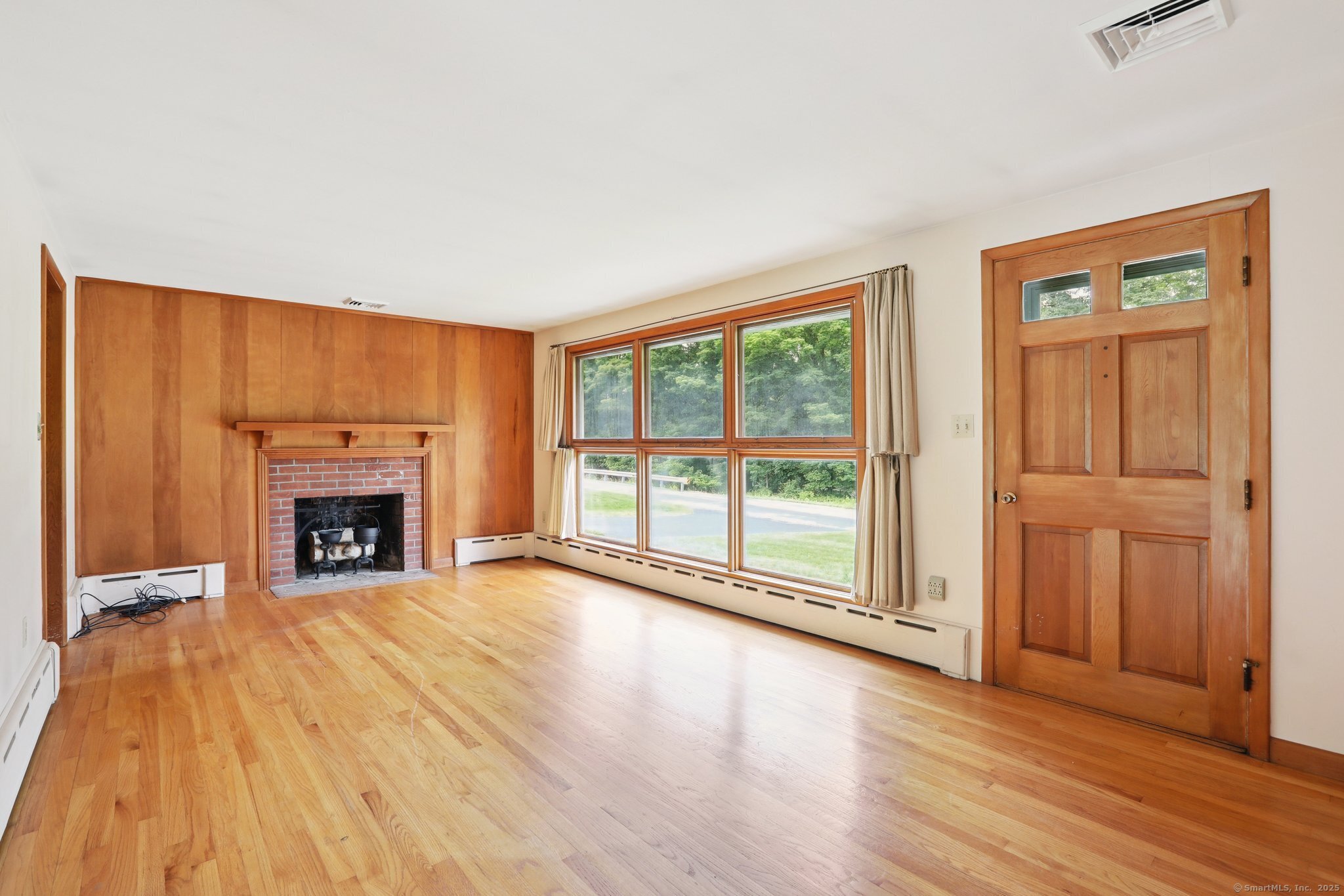 77 Old Middle Road Brookfield, CT 06804 - Photo 9 of 31 a view of an empty room with a fireplace and a window