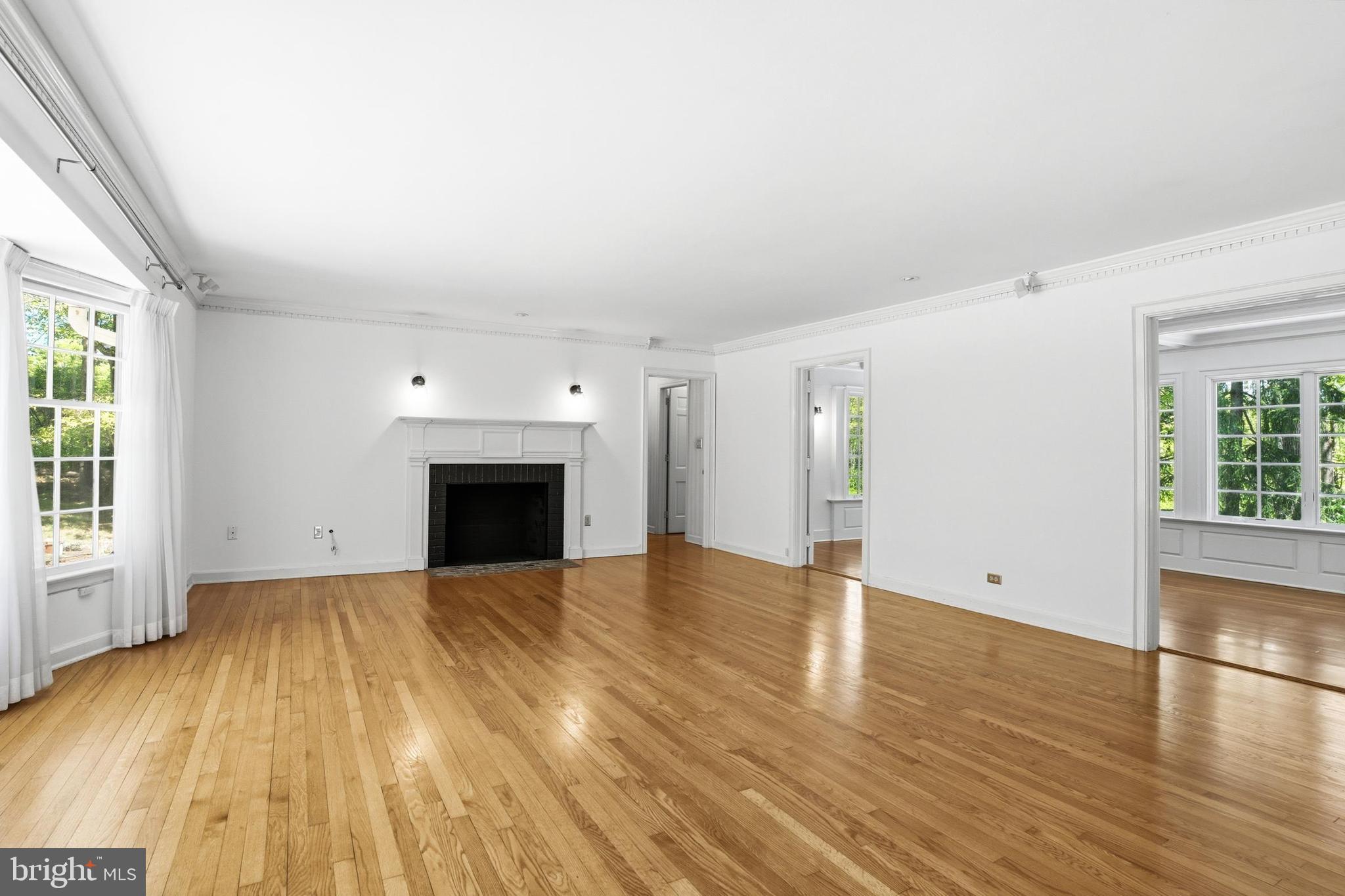 4511 Province Line Road Princeton, NJ 08540 - Photo 8 of 34 a view of empty room with wooden floor and fireplace