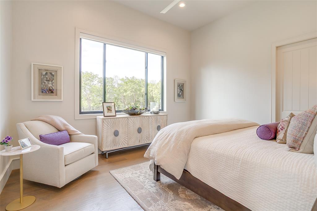 5000 T W King Road Southlake, TX 76092 - Photo 17 of 40 a bedroom with a bed and a couch