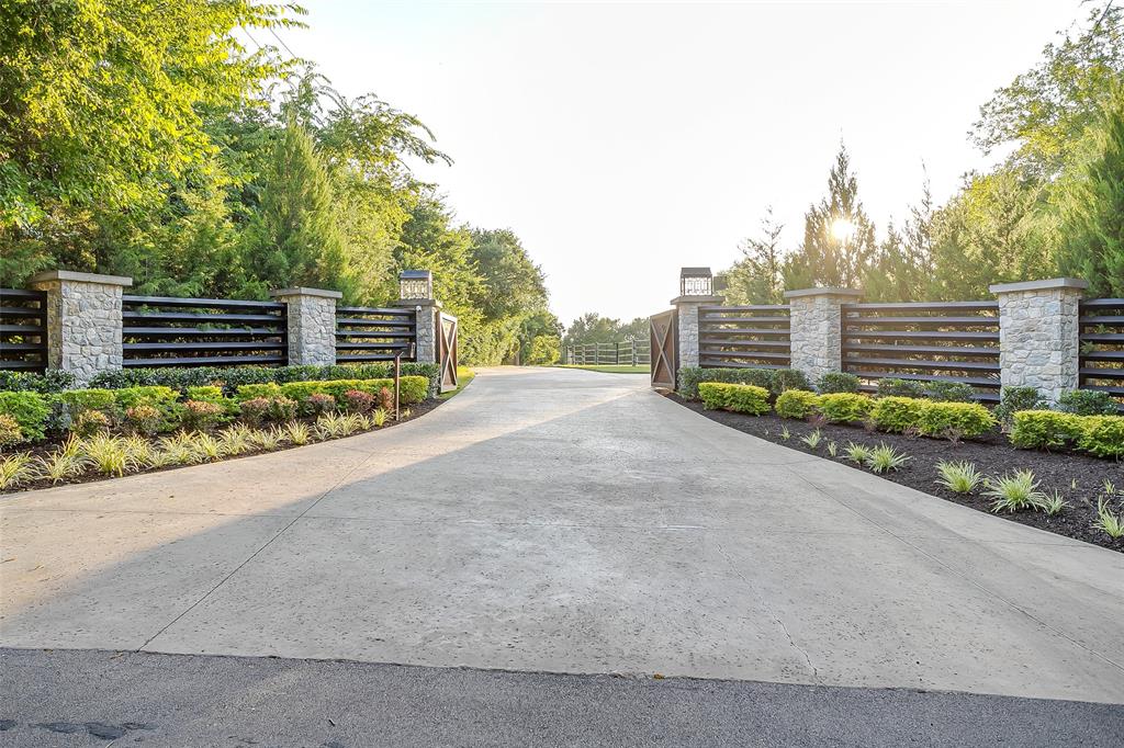 5000 T W King Road Southlake, TX 76092 - Photo 39 of 40 a view of a house with a yard and large trees