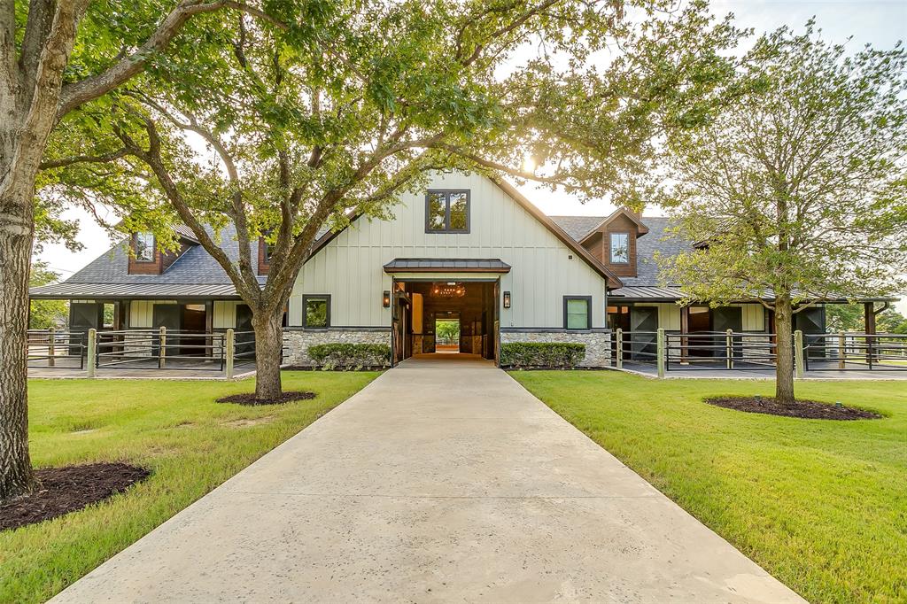 5000 T W King Road Southlake, TX 76092 - Photo 6 of 40 a front view of a house with a yard and trees