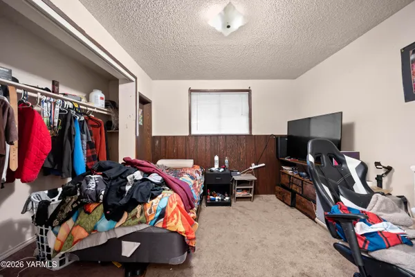a bed room with a bed and a desk