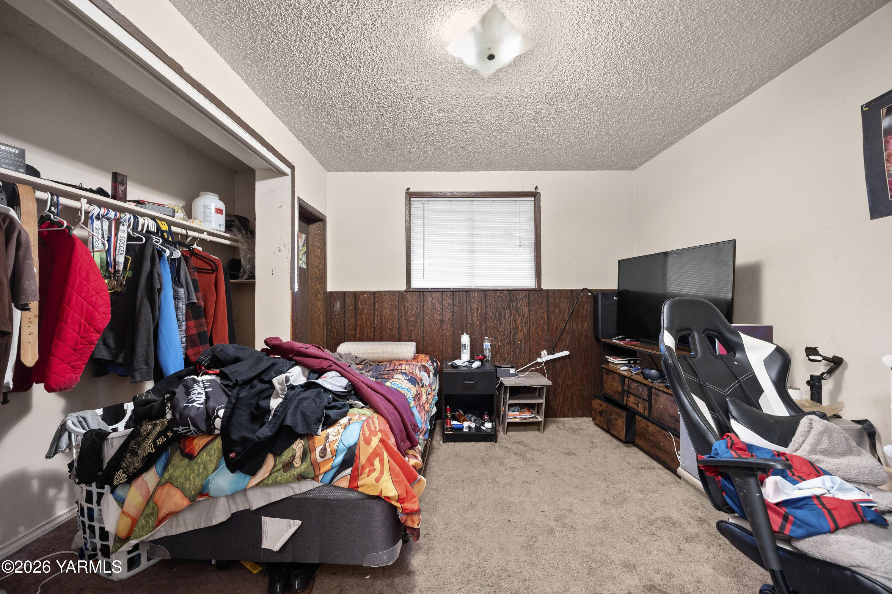 115 East D Street Wapato, WA 98951 - Photo 11 of 28 a bed room with a bed and a desk