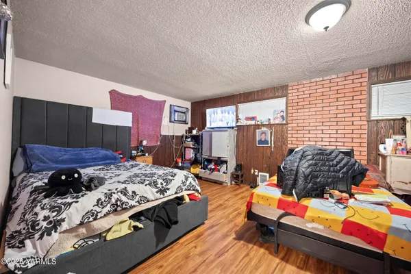 a bedroom with bed and a window