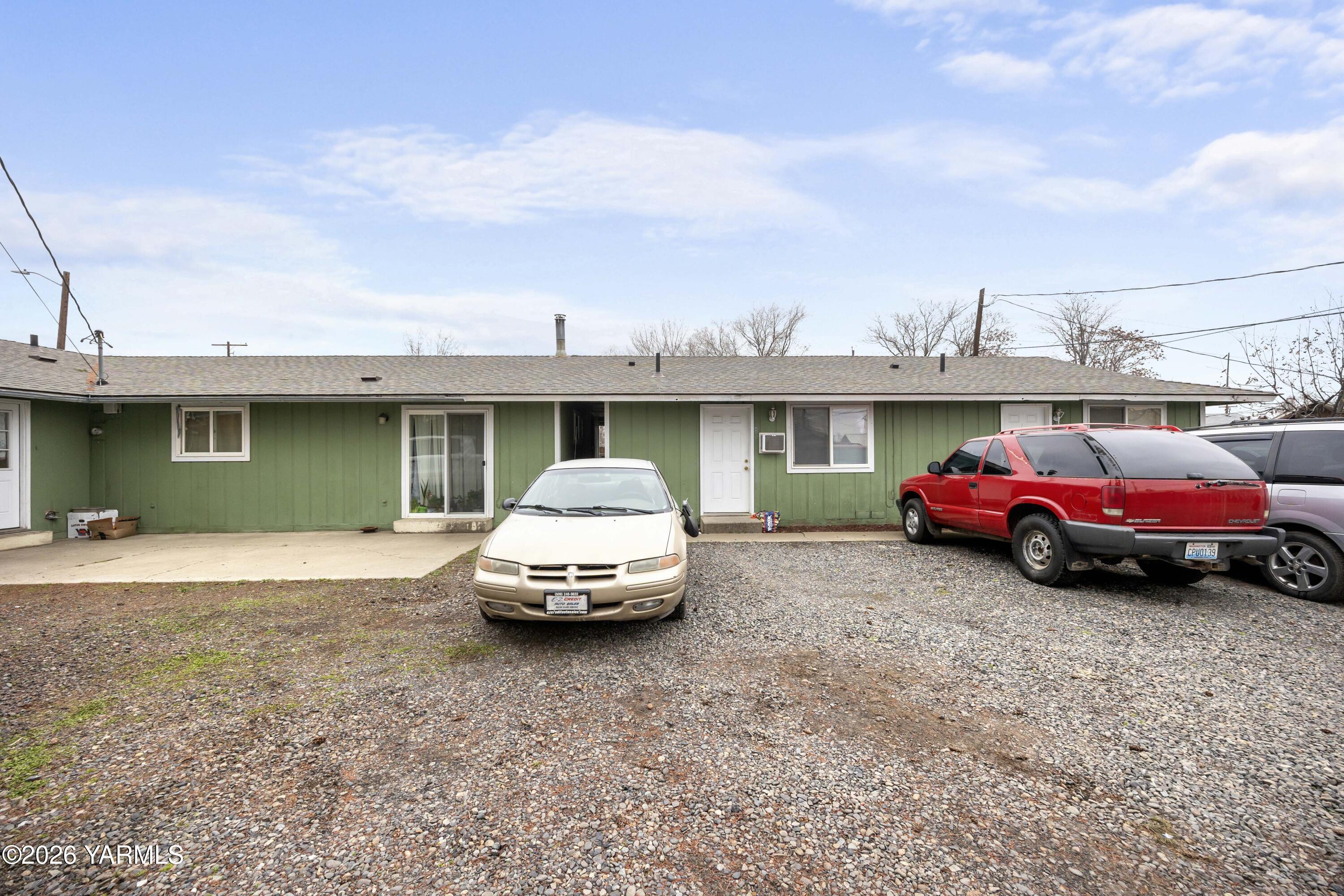 115 East D Street Wapato, WA 98951 - Photo 20 of 28 a car parked in front of a house