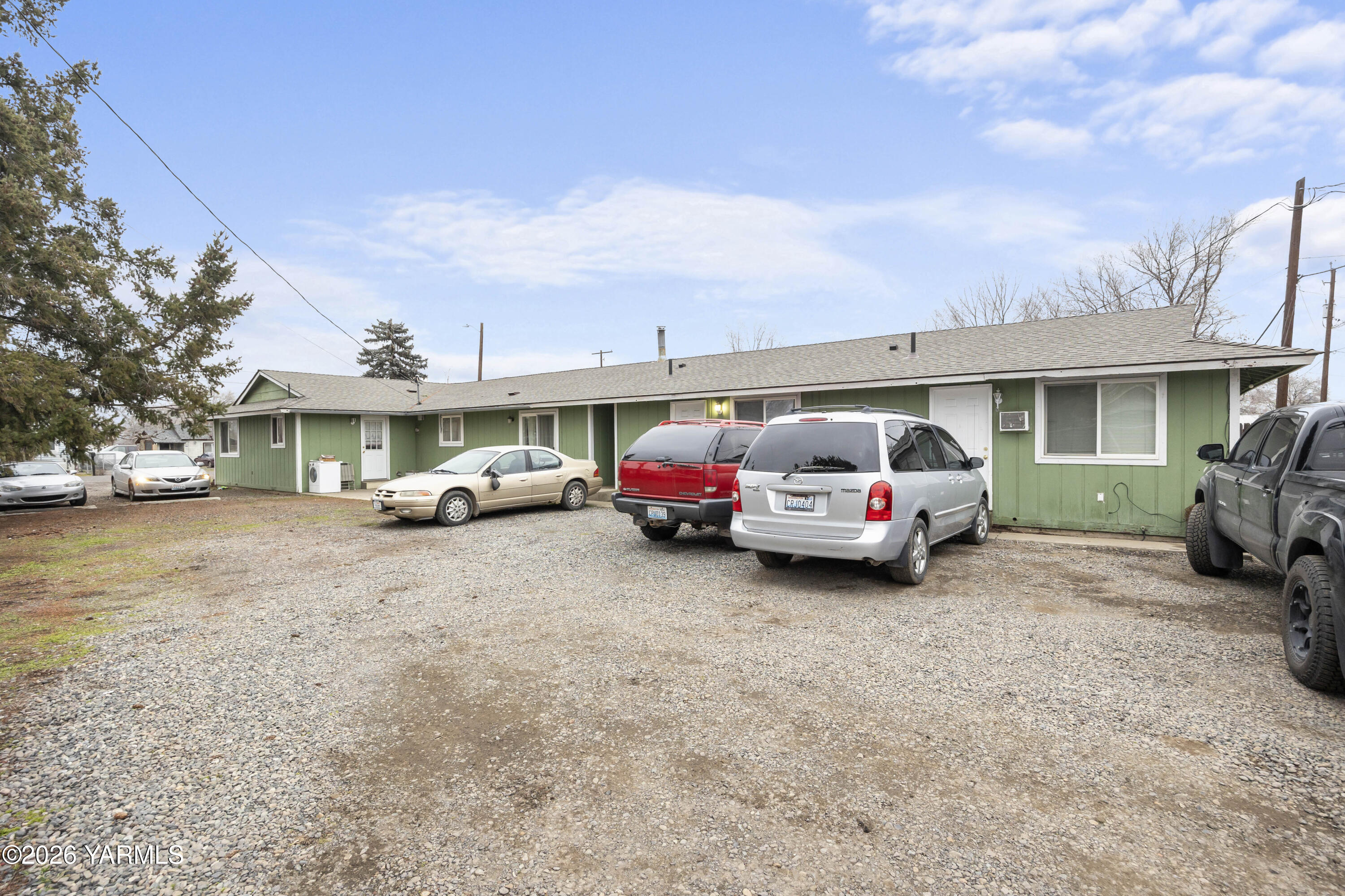 115 East D Street Wapato, WA 98951 - Photo 21 of 28 a view of a car parked in front of a house