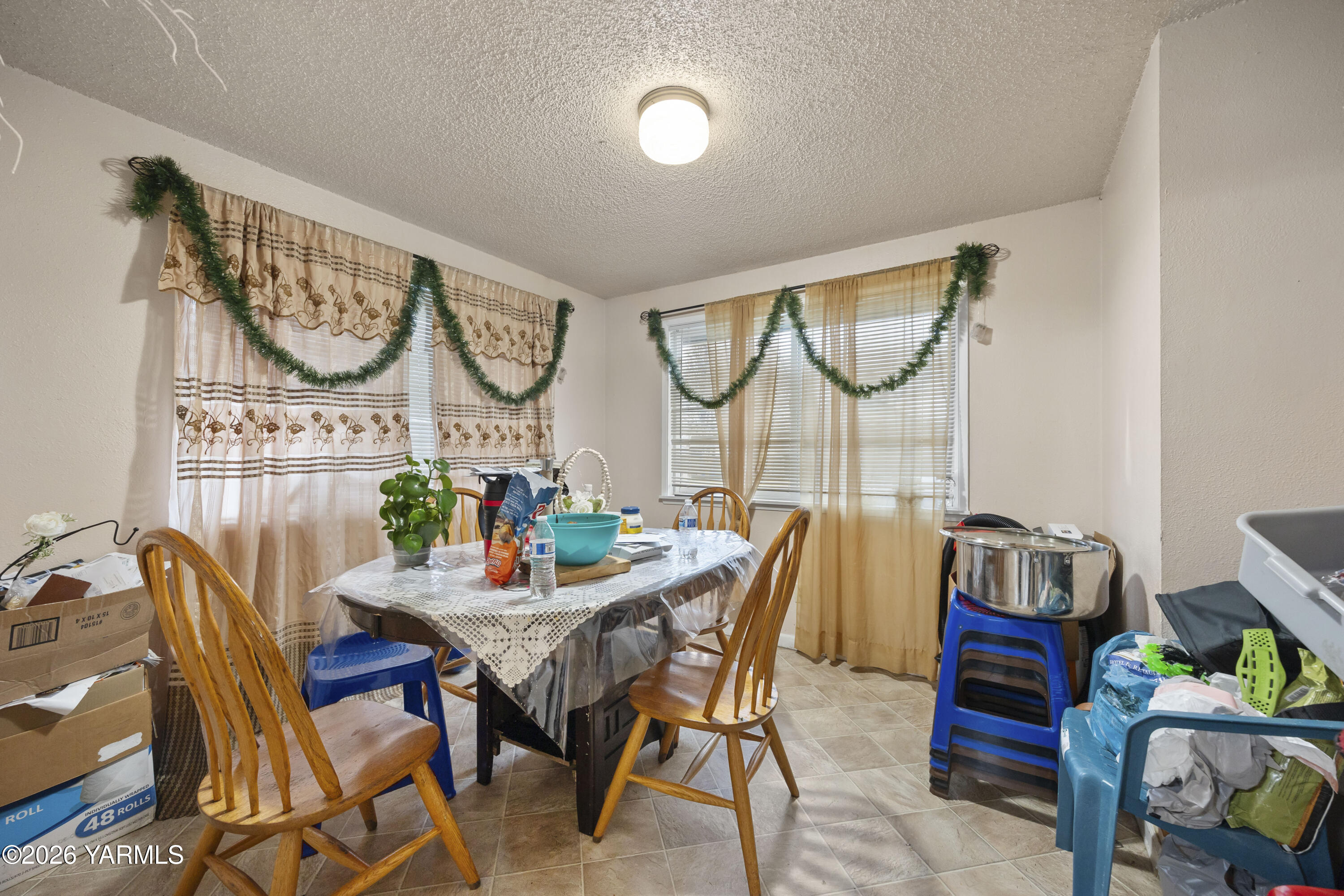 115 East D Street Wapato, WA 98951 - Photo 4 of 28 a dining room with furniture and a wooden floor