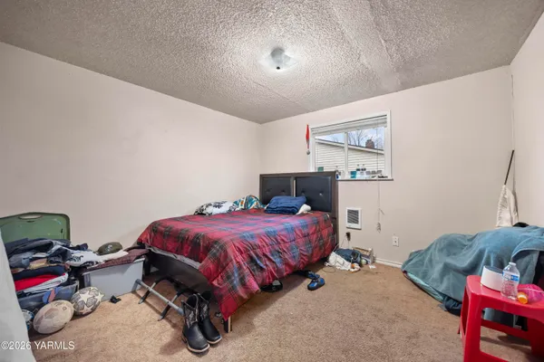 a bedroom with furniture and a bed