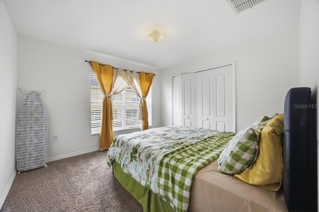 5410 Quarry Rock Road Lakeland, FL 33809 - Photo 19 of 26 a bedroom with a bed and a window