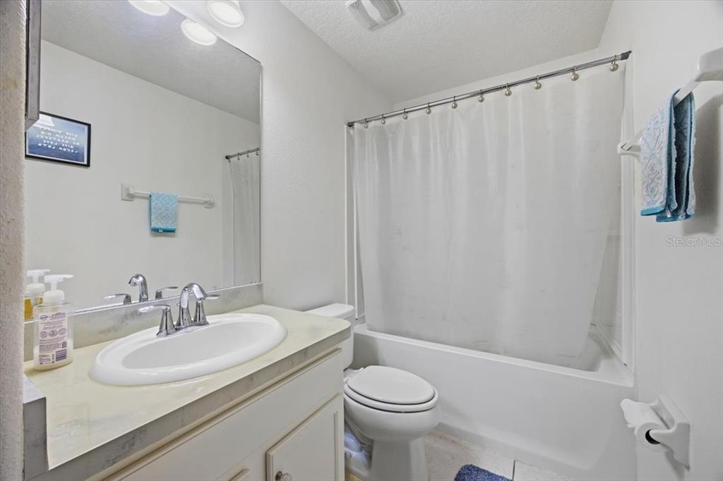 5410 Quarry Rock Road Lakeland, FL 33809 - Photo 21 of 26 a bathroom with a sink toilet and shower