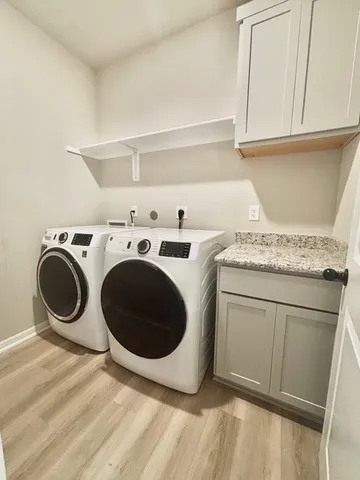 an empty room with fan and entrance