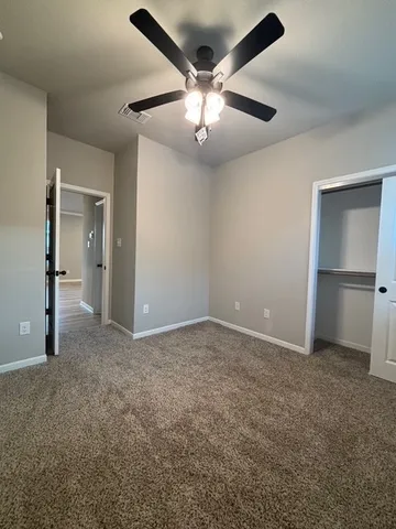 a large kitchen with kitchen island a sink stainless steel appliances and cabinets