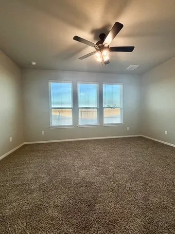 a spacious bathroom with a granite countertop sink mirror and