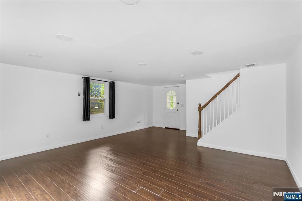 67 Nolans Point Road Lake Hopatcong, NJ 07849 - Photo 13 of 43 a view of an empty room with wooden floor and windows