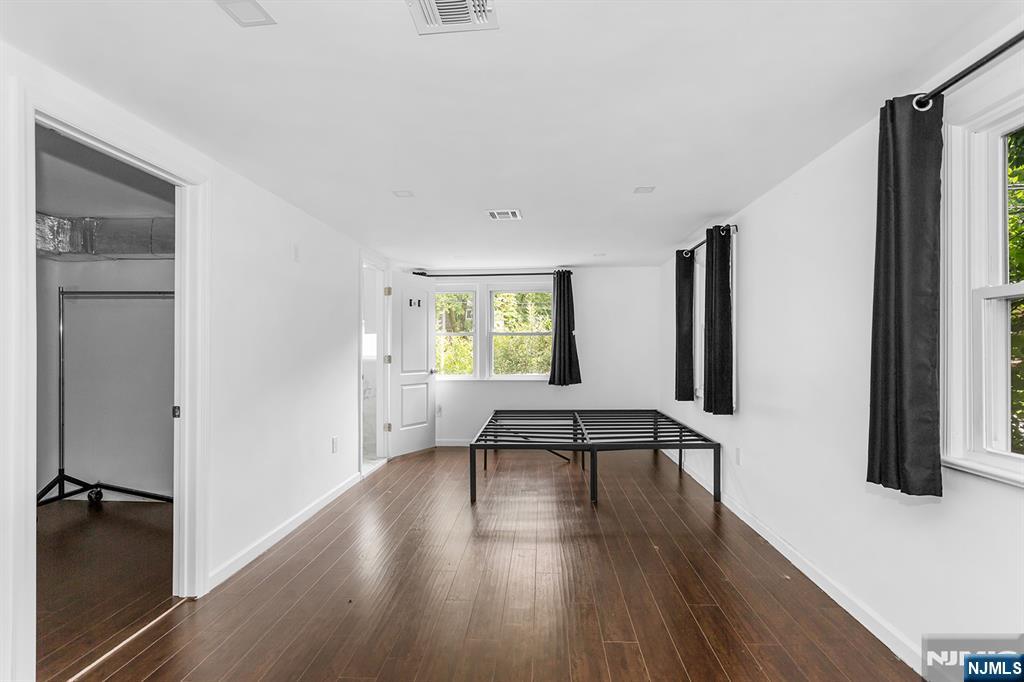67 Nolans Point Road Lake Hopatcong, NJ 07849 - Photo 15 of 43 a view of an empty room with wooden floor and a window