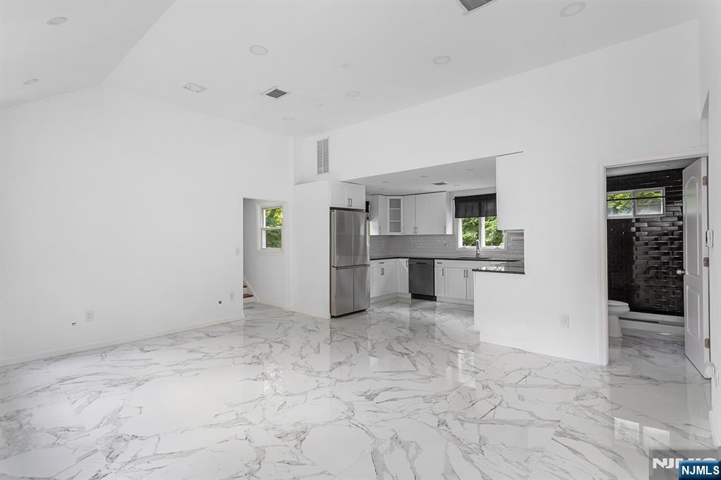 67 Nolans Point Road Lake Hopatcong, NJ 07849 - Photo 3 of 43 a view of a kitchen with refrigerator and windows