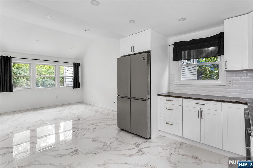 67 Nolans Point Road Lake Hopatcong, NJ 07849 - Photo 9 of 43 a kitchen with a refrigerator and a sink