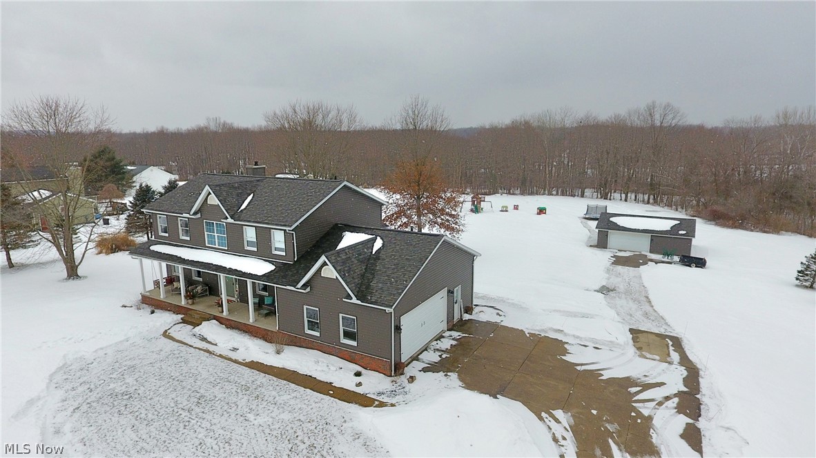 6087 Hanna Road Ravenna, OH 44266 - Photo 3 of 34 Aerial side view of the home shows you the attached and detached garage!