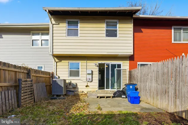 a view of a small house and outdoor space