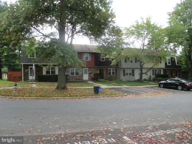 a view of street with a parked cars