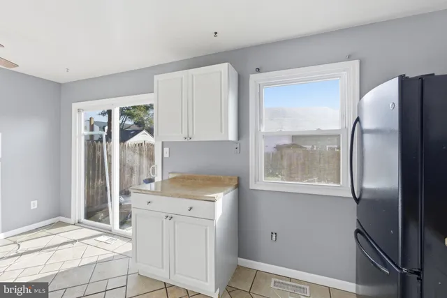 a room with a bed closet and mirror